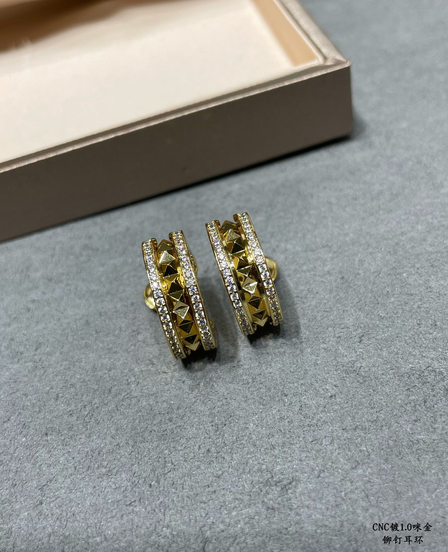 B*l*ai drill rivets on both sides earrings