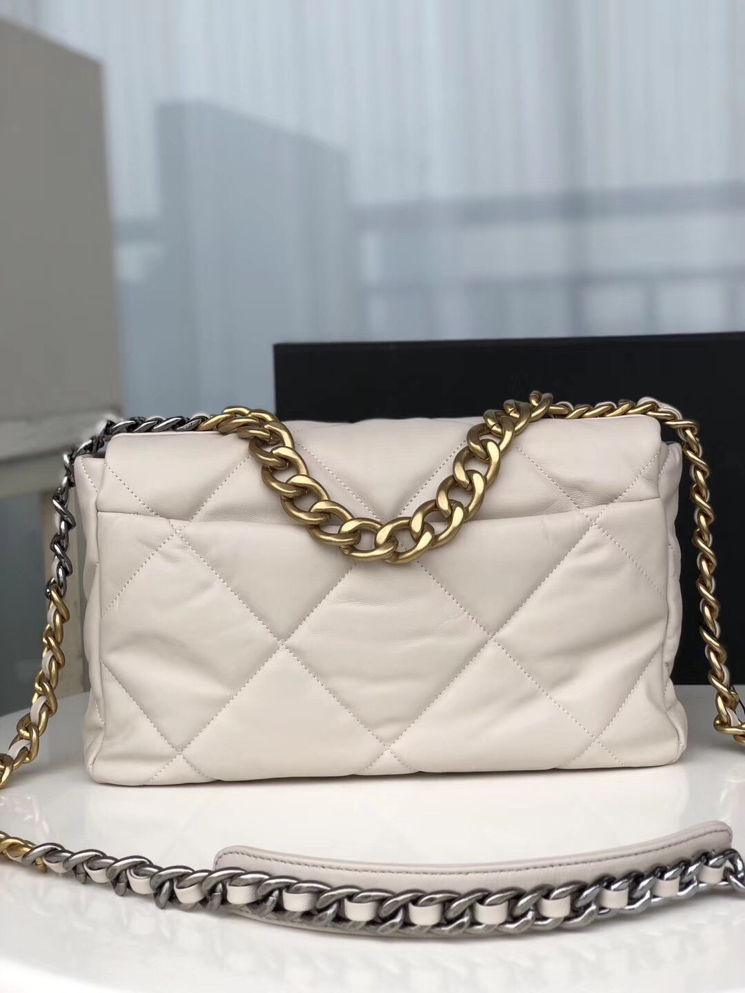 Ch*el 19 large handbag shiny leather, gold-tone, silver-tone & ruthenium-finish metal beige 7.8 × 11.7 × 3.9 in