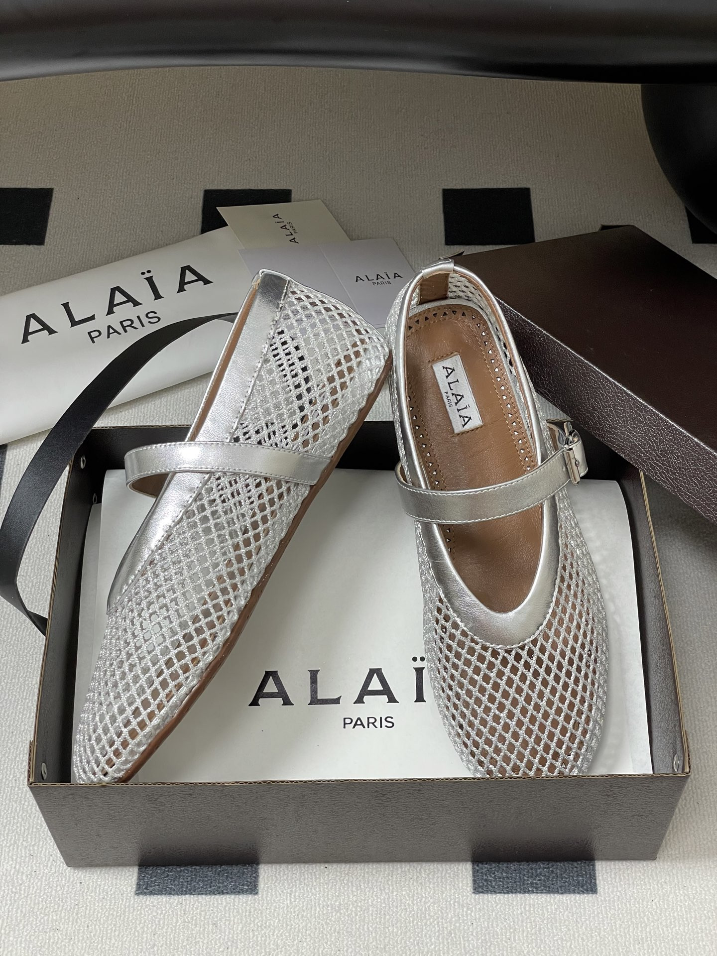 UA ALAÏA BALLET FLATS IN FISHNET