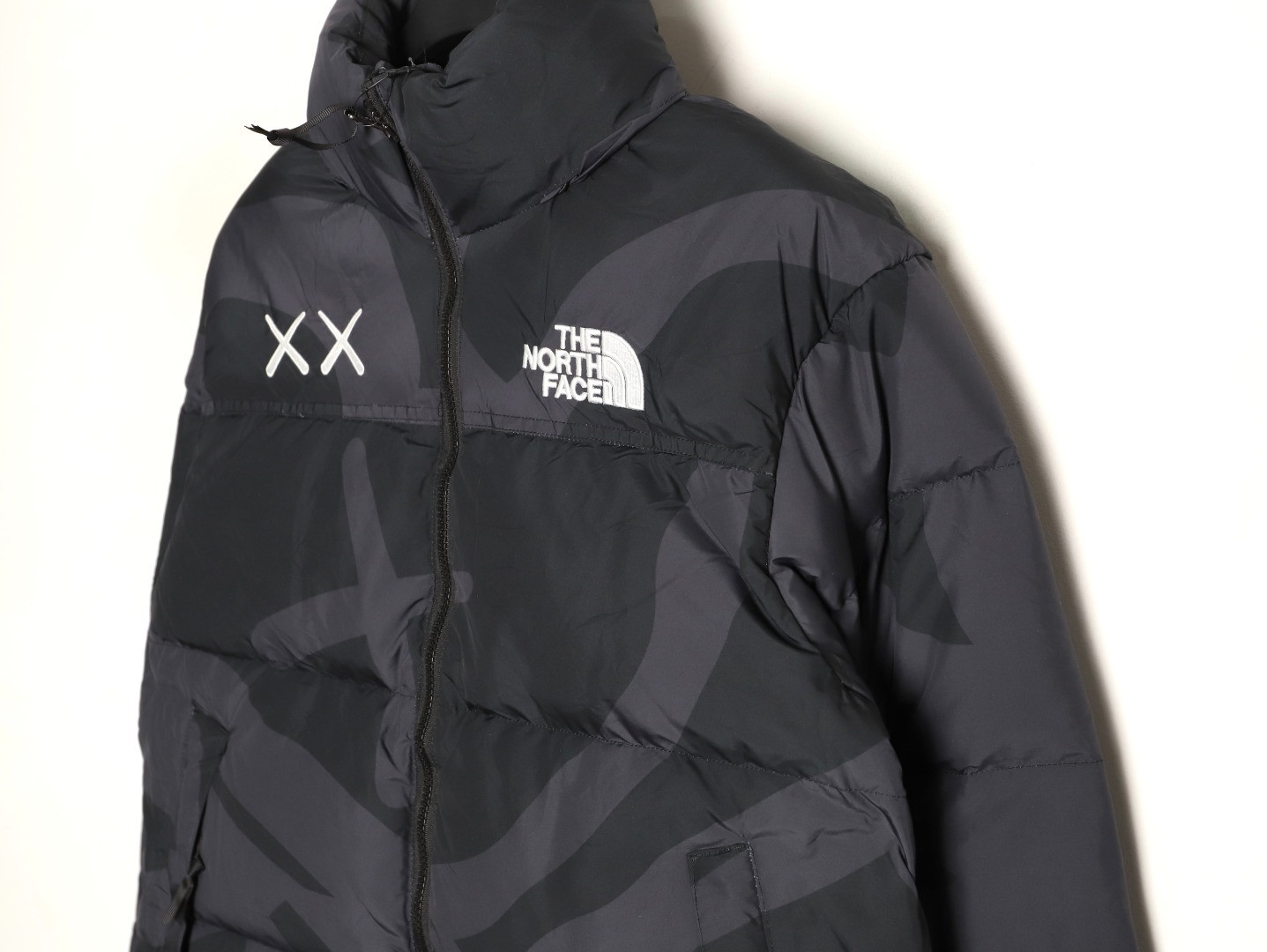 the n0r*h Fa*e x kaws short puffer jacket