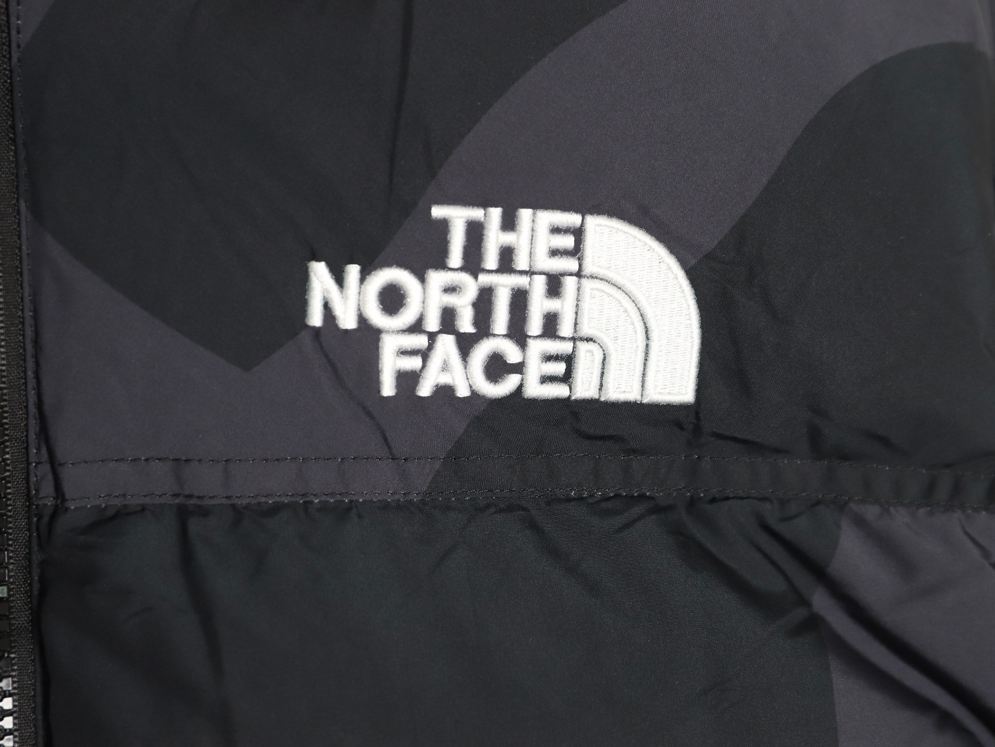 the n0r*h Fa*e x kaws short puffer jacket