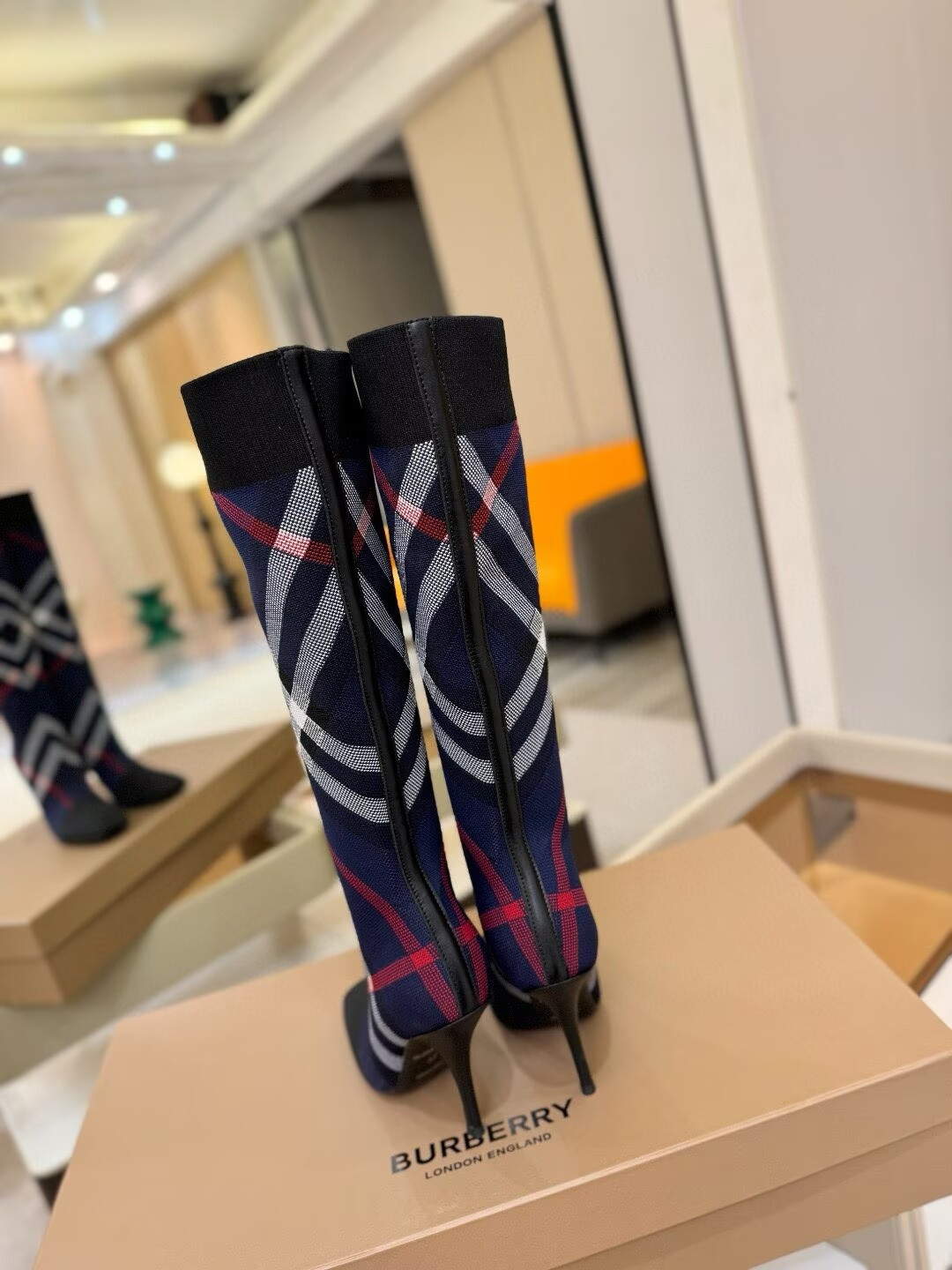 ua Bv*b*rry check high boots