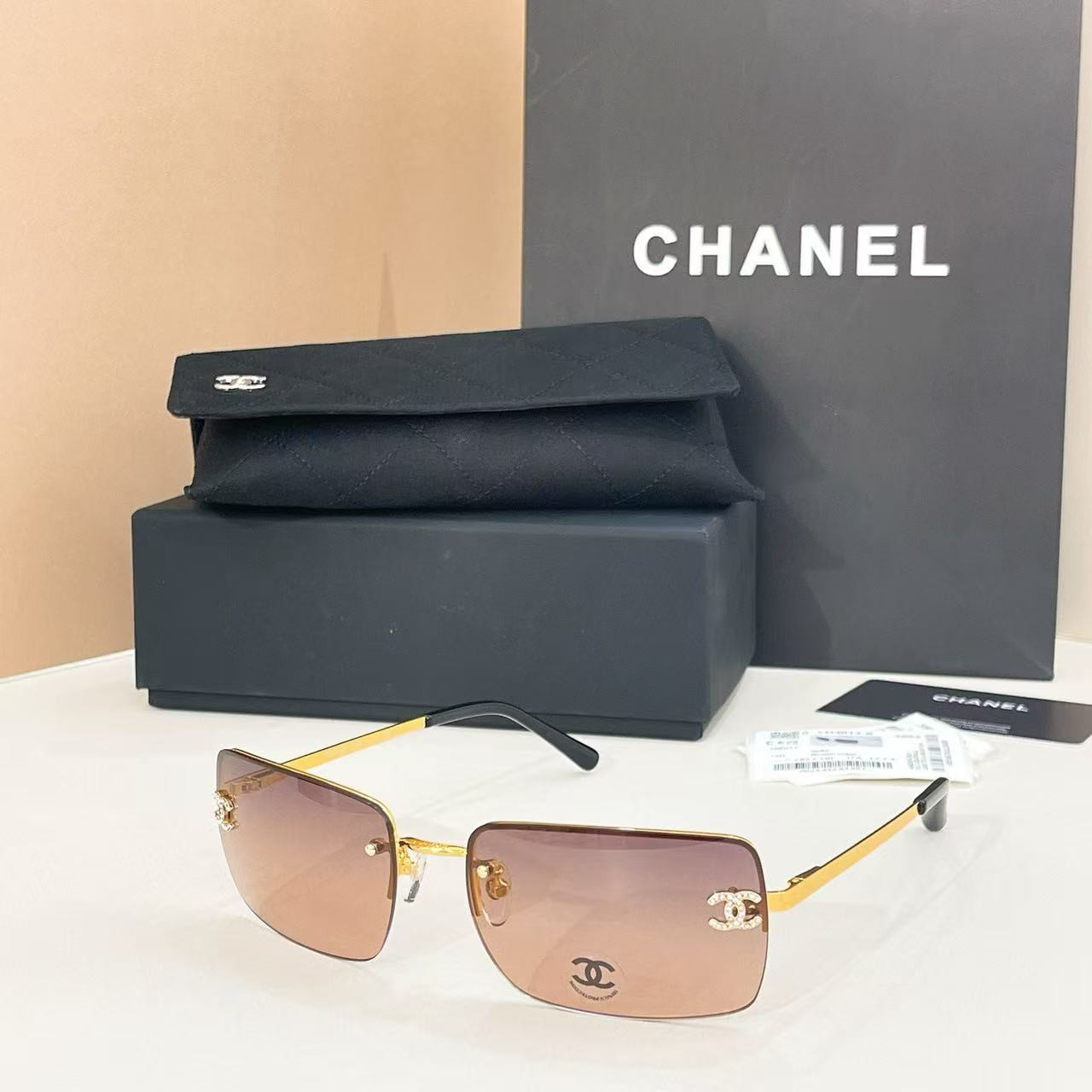 Ch**el crystal logo glasses