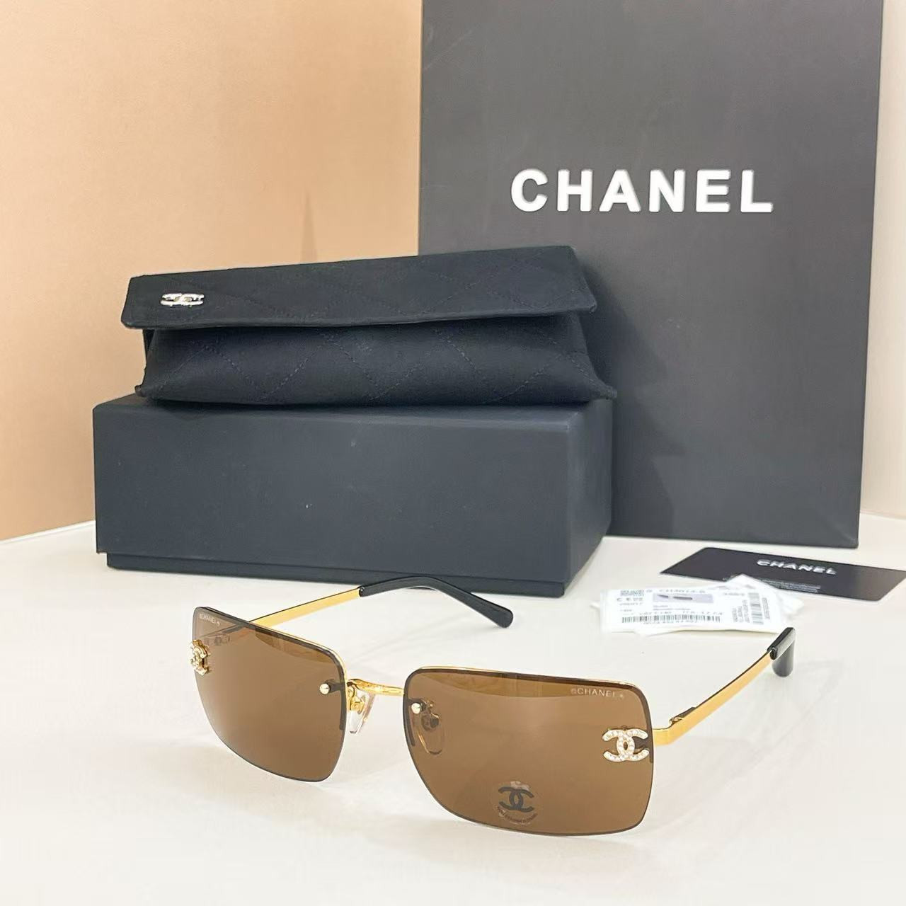 Ch**el crystal logo glasses