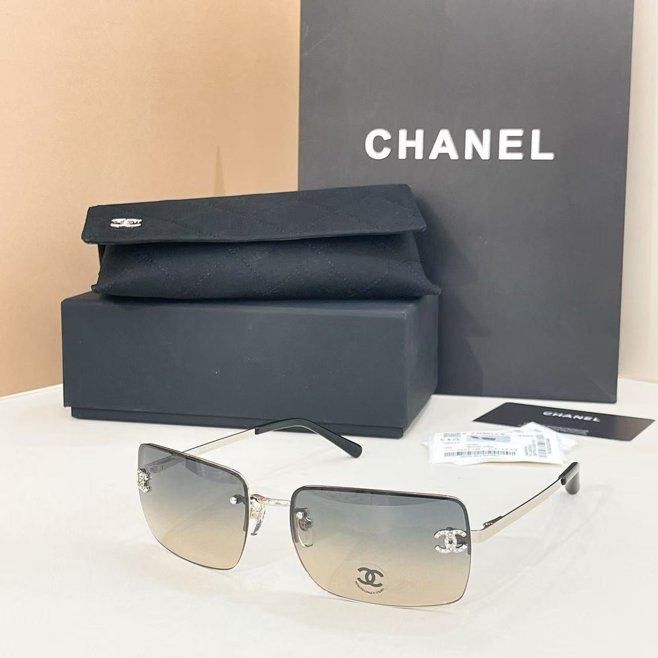 Ch**el crystal logo glasses