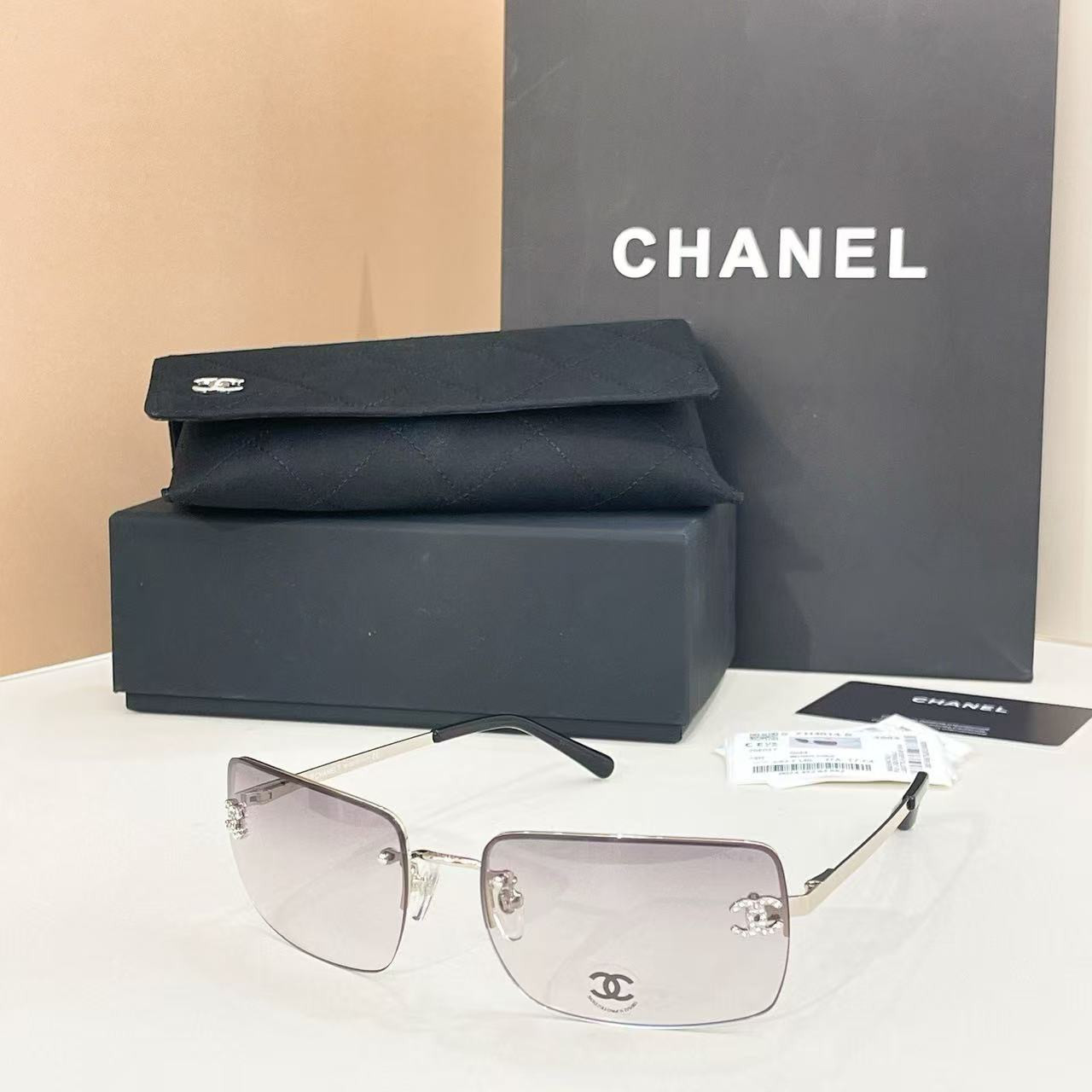 Ch**el crystal logo glasses