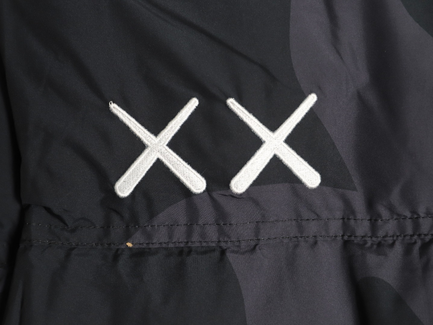 the n0r*h Fa*e x kaws short puffer jacket
