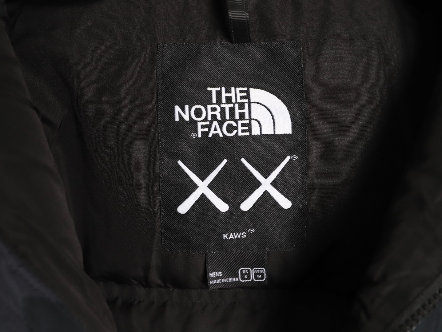 the n0r*h Fa*e x kaws short puffer jacket