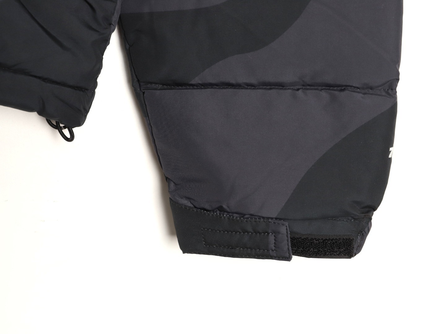 the n0r*h Fa*e x kaws short puffer jacket