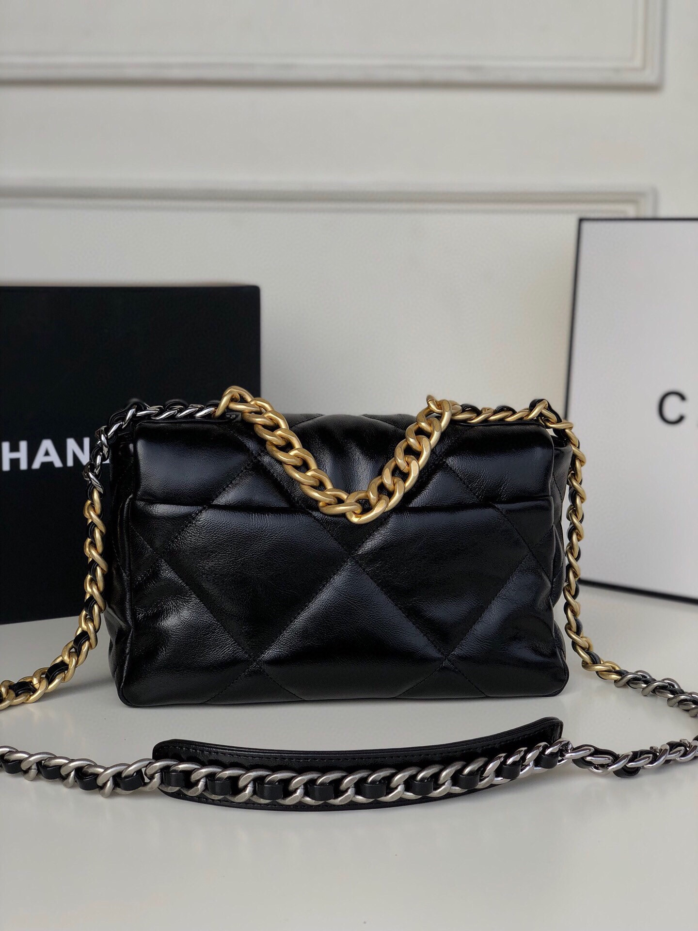 Ch**el 19 HANDBAG Shiny Leather, Gold-Tone, Silver-Tone & Ruthenium-Finish Metal Black 6.2 × 10.1 × 3.5 in